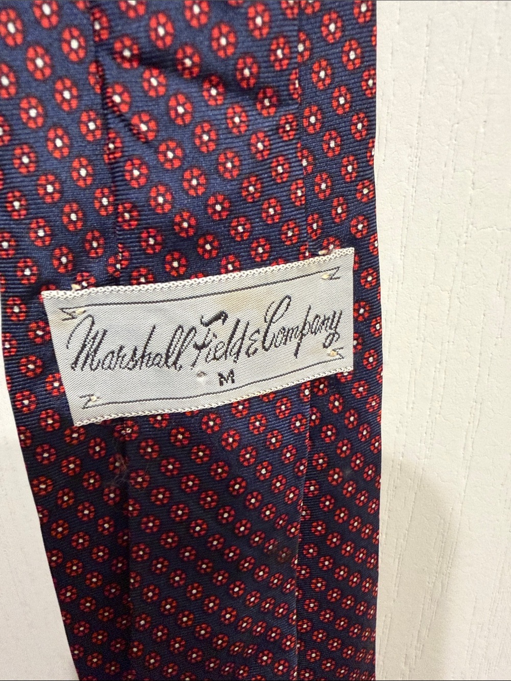 100% silk Marshall Field & Company Navy Tie with Red Medallion Pattern